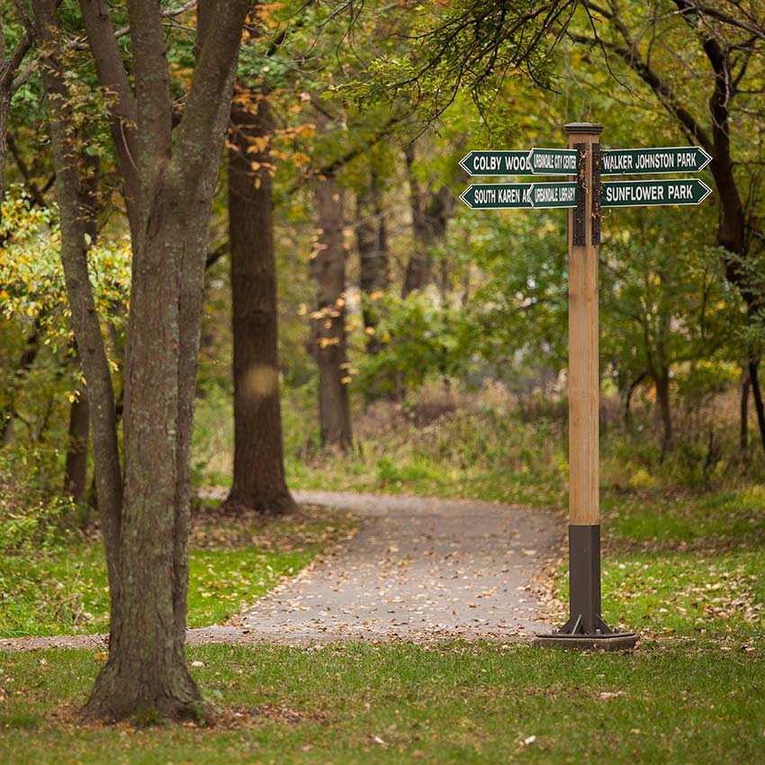 image of a directional sign on a trail